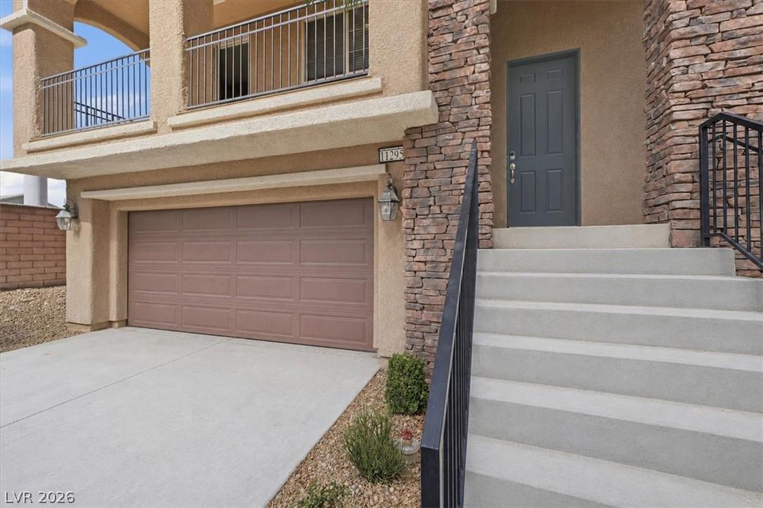 Image 3: Stone accents and a private entrance elevate this