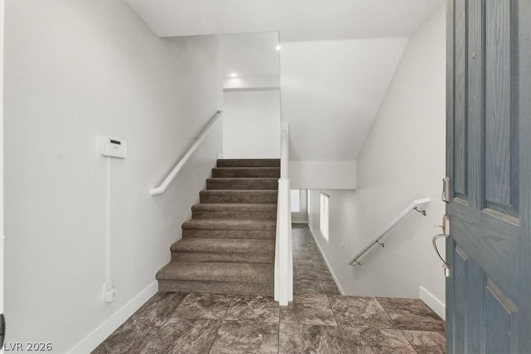 Image 4: A welcoming entryway features easy-to-maintain til