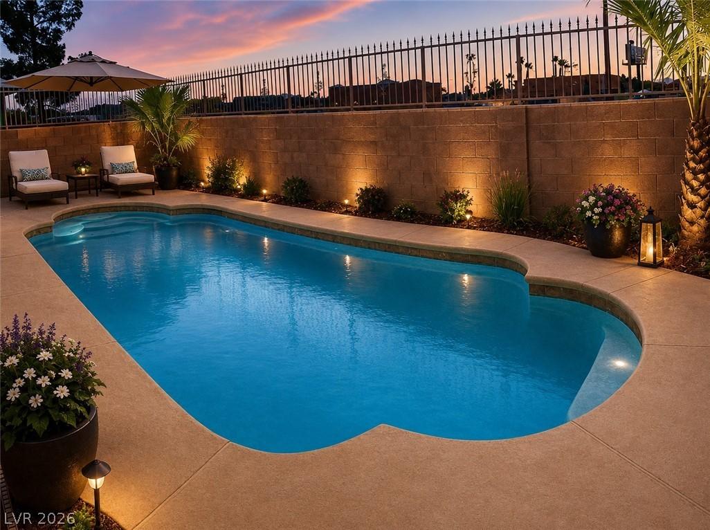 Image 2: A refreshing private pool awaits in the backyard,