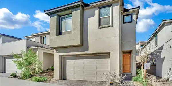 Image 3: A modern two-story exterior showcases clean archit