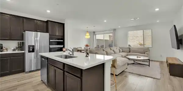 Image 4: An open floorplan seamlessly connects the modern k
