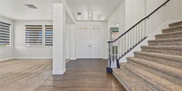 Image 4: A welcoming entryway transitions seamlessly into a