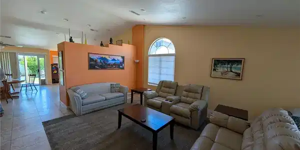 Image 3: Natural light filters through an arched window, il