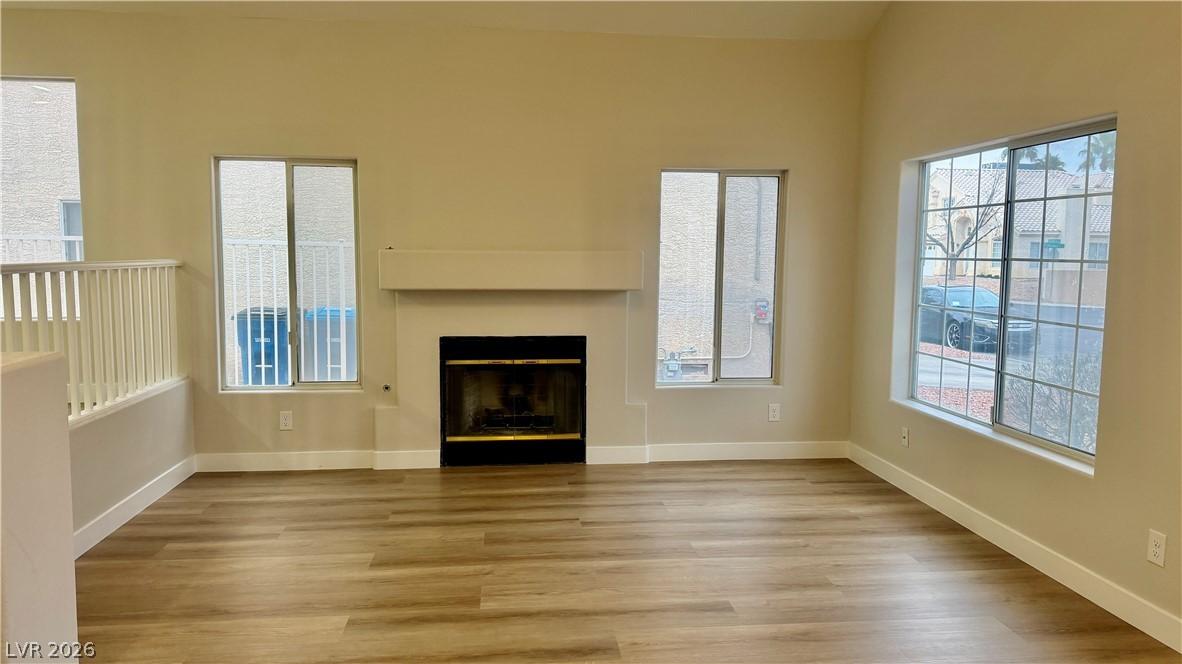 Image 3: Unfurnished living room featuring a fireplace and