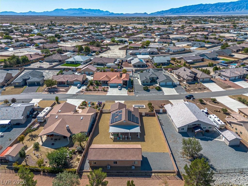 Image 3: Aerial view of residential area featuring mountain