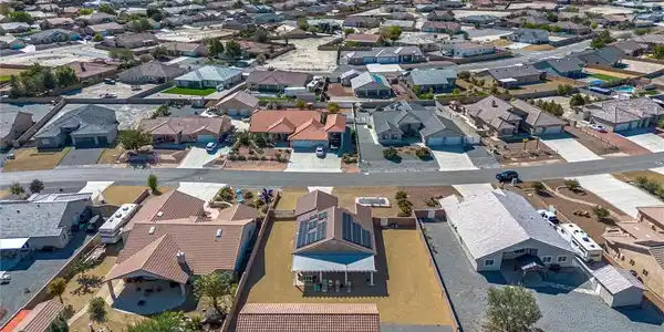 Image 3: Aerial view of residential area featuring mountain