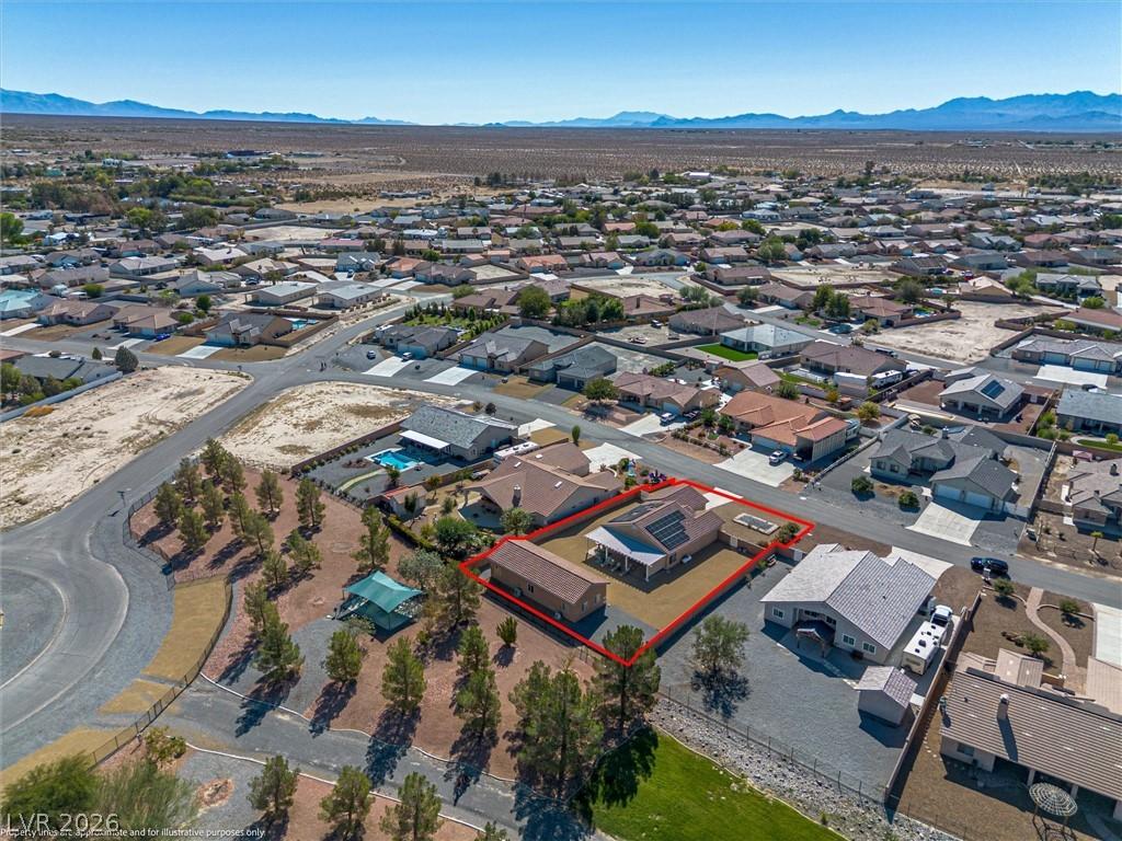 Image 4: Aerial perspective of suburban area with property