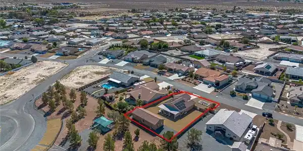 Image 4: Aerial perspective of suburban area with property