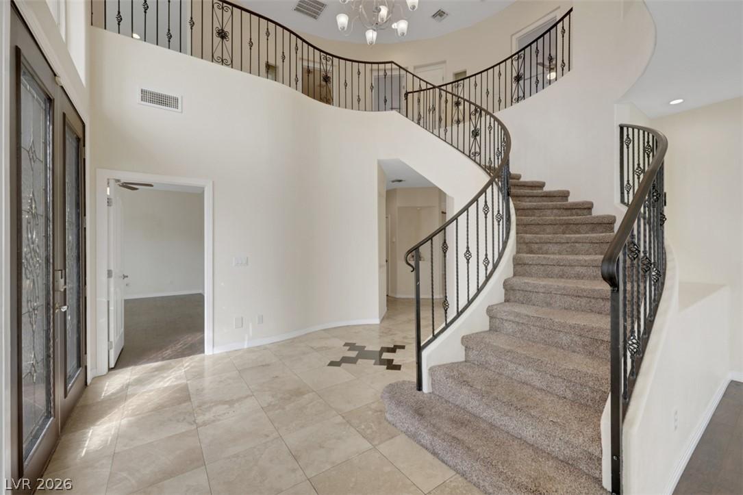 Image 3: A grand entrance welcomes with a dual-sided stairc