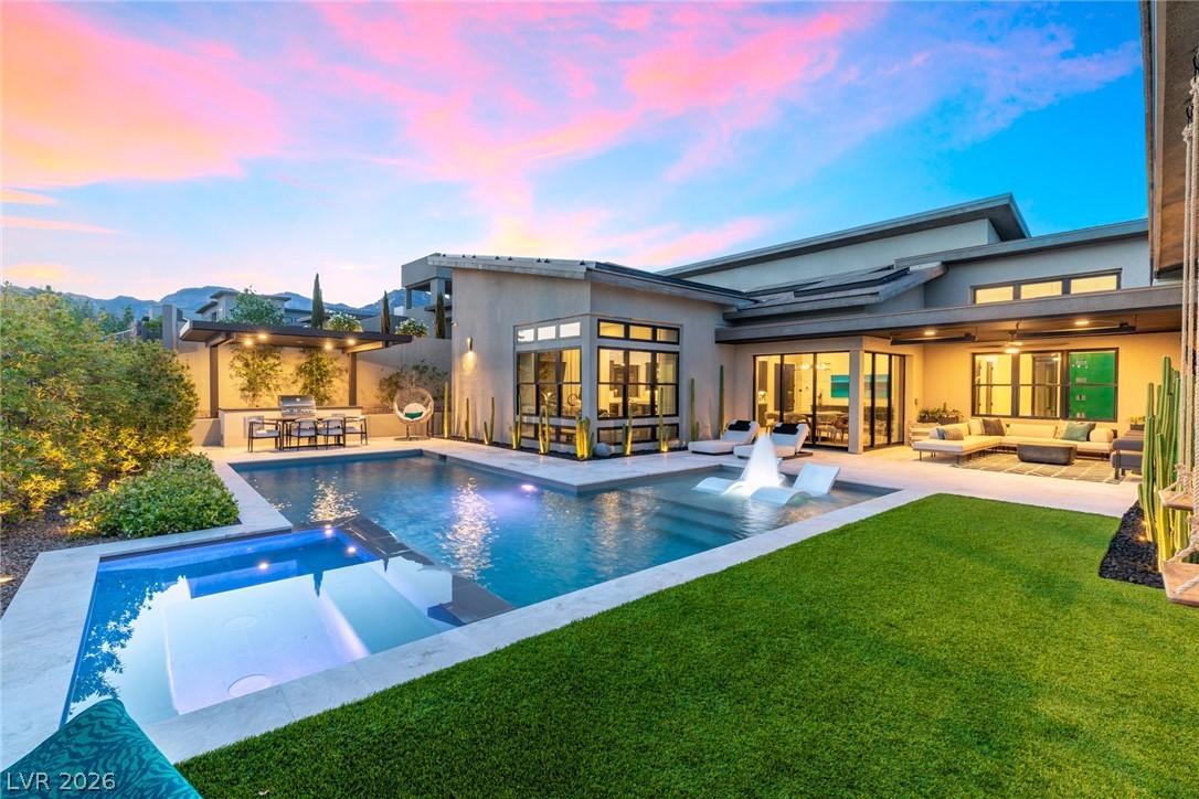 Image 3: This impeccably designed private backyard oasis of