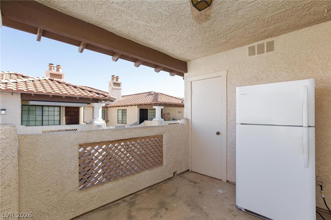 Image 4: A private patio space, ready for relaxation, offer