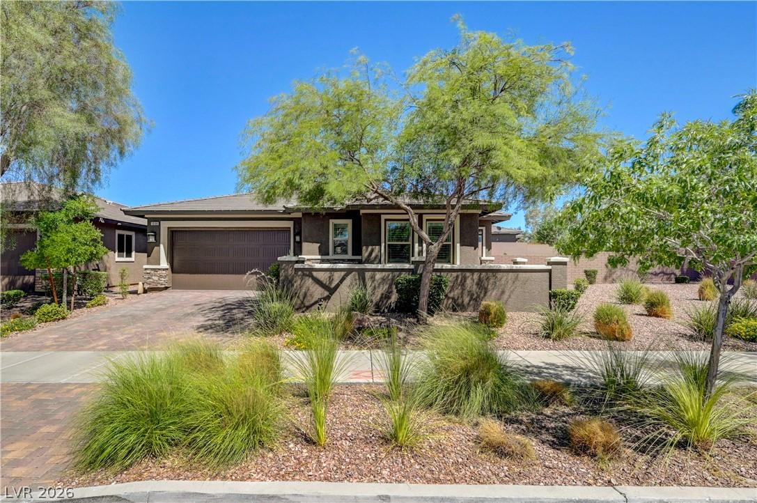 Image 2: A well-landscaped front yard with desert-friendly