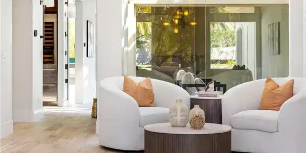 Image 4: A welcoming sitting area with wood flooring flows