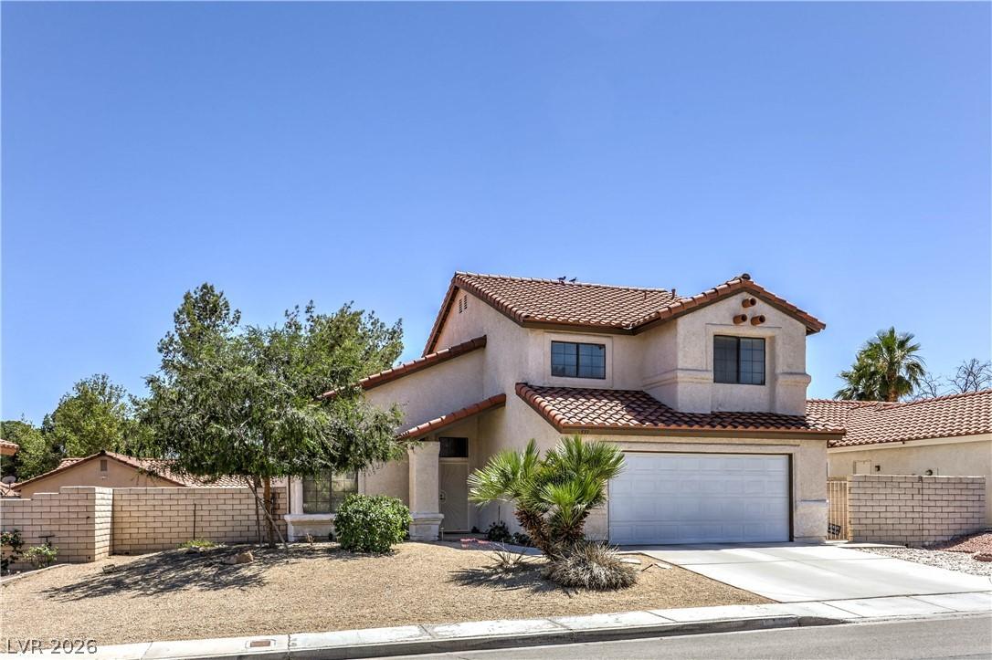 Image 2: This desert dwelling features a tile roof, stucco