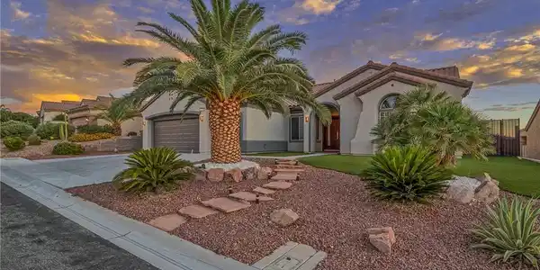 Image 4: Dramatic sunset hues enhance this home's desert-fr