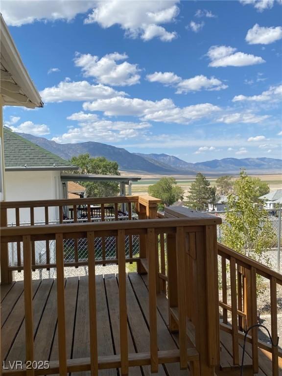 Image 2: Wooden deck with a mountain view