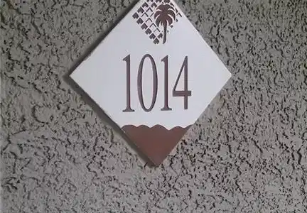Image 4: This outdoor detail shot features a clear address