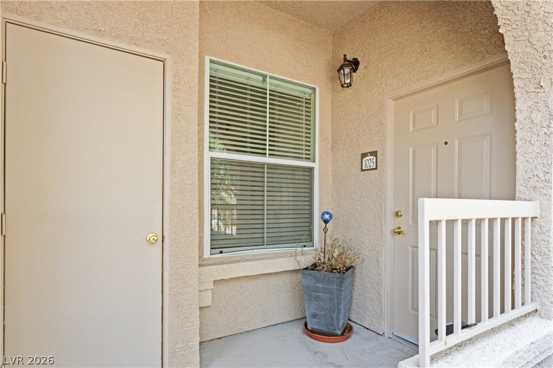 Image 2: A welcoming entry with warm stucco and functional