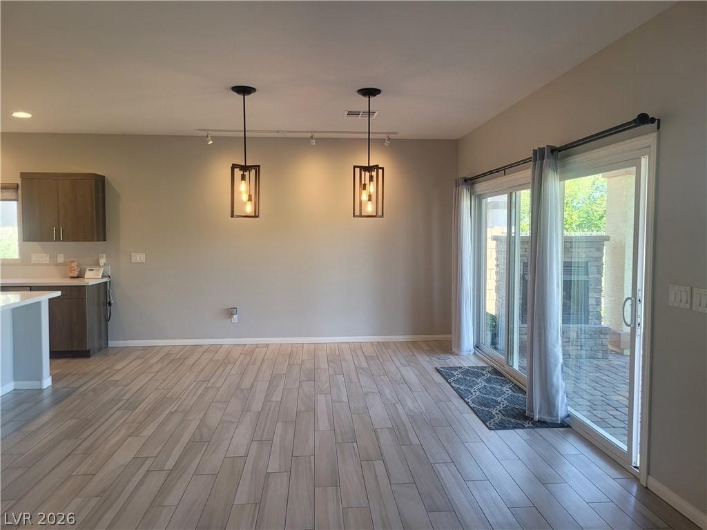 Image 2: A modern kitchen, bathed in natural light from a