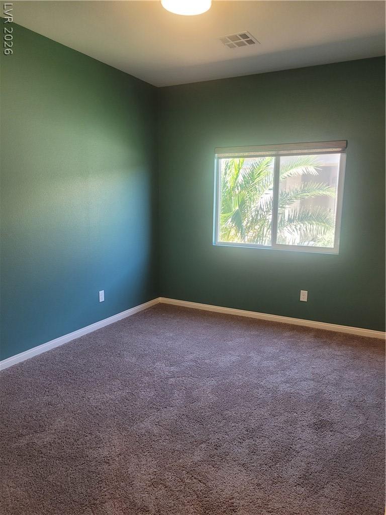 Image 4: An inviting secondary bedroom offers soft carpetin