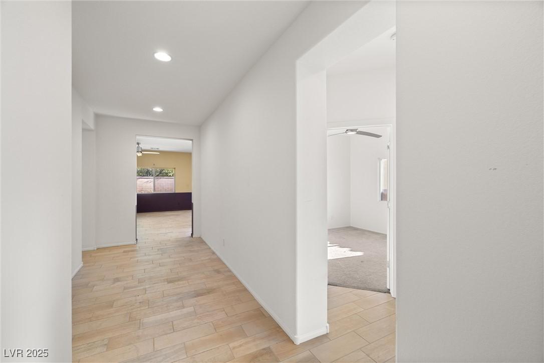 Image 3: Hall featuring light wood-style flooring and reces