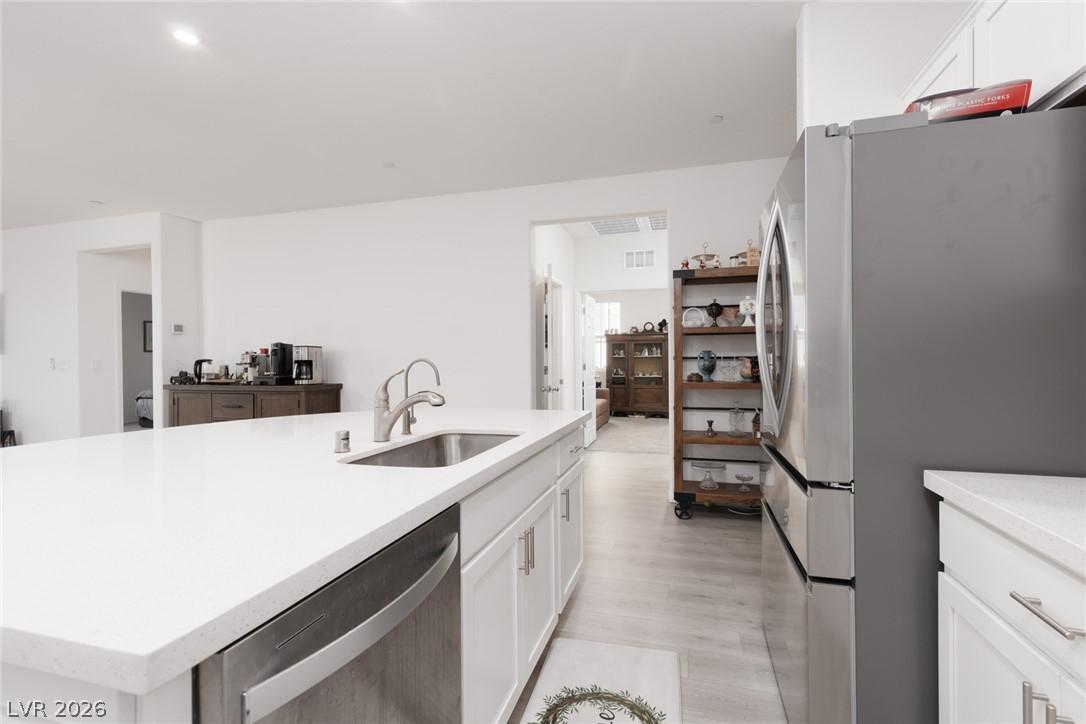 Image 4: A well-appointed kitchen island with gleaming coun