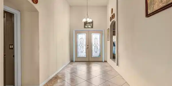 Image 3: Elegant entry with ornate double doors and a polis
