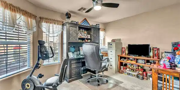 Image 4: This versatile room offers a functional office spa