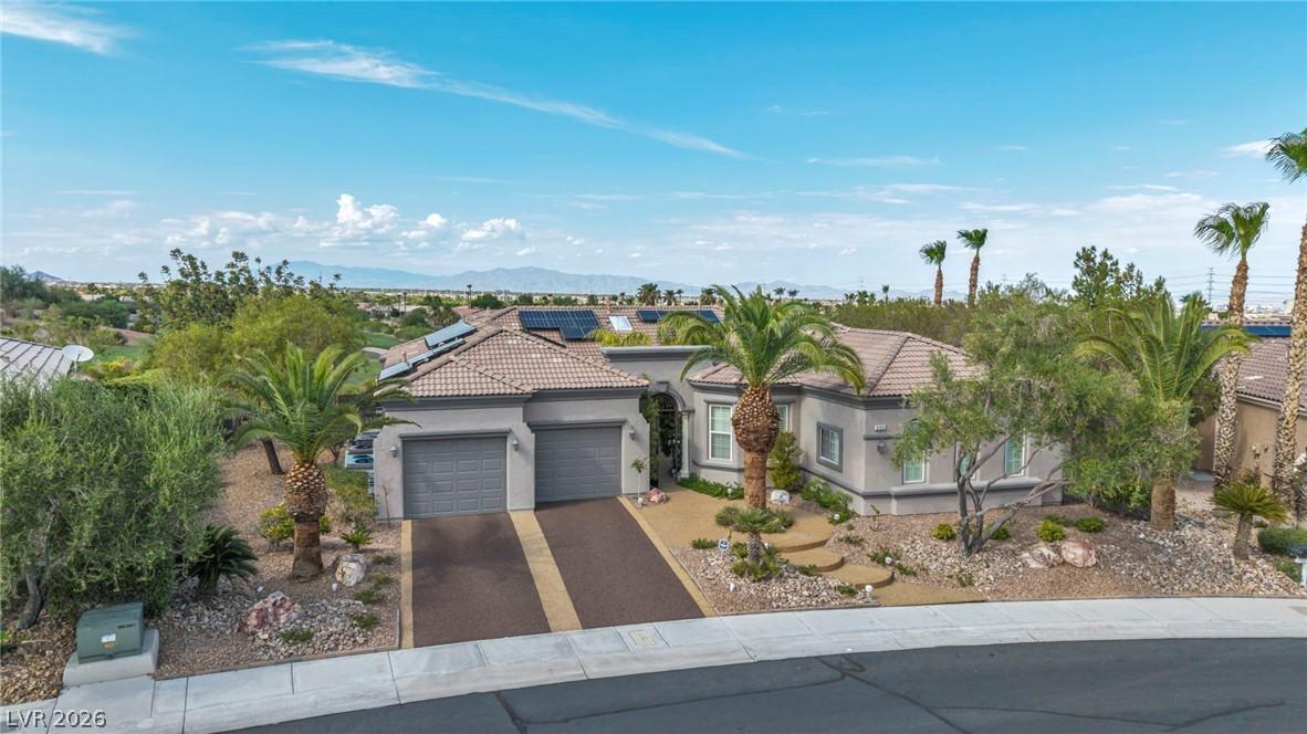 Image 2: A desert oasis home presents a gracefully curved d