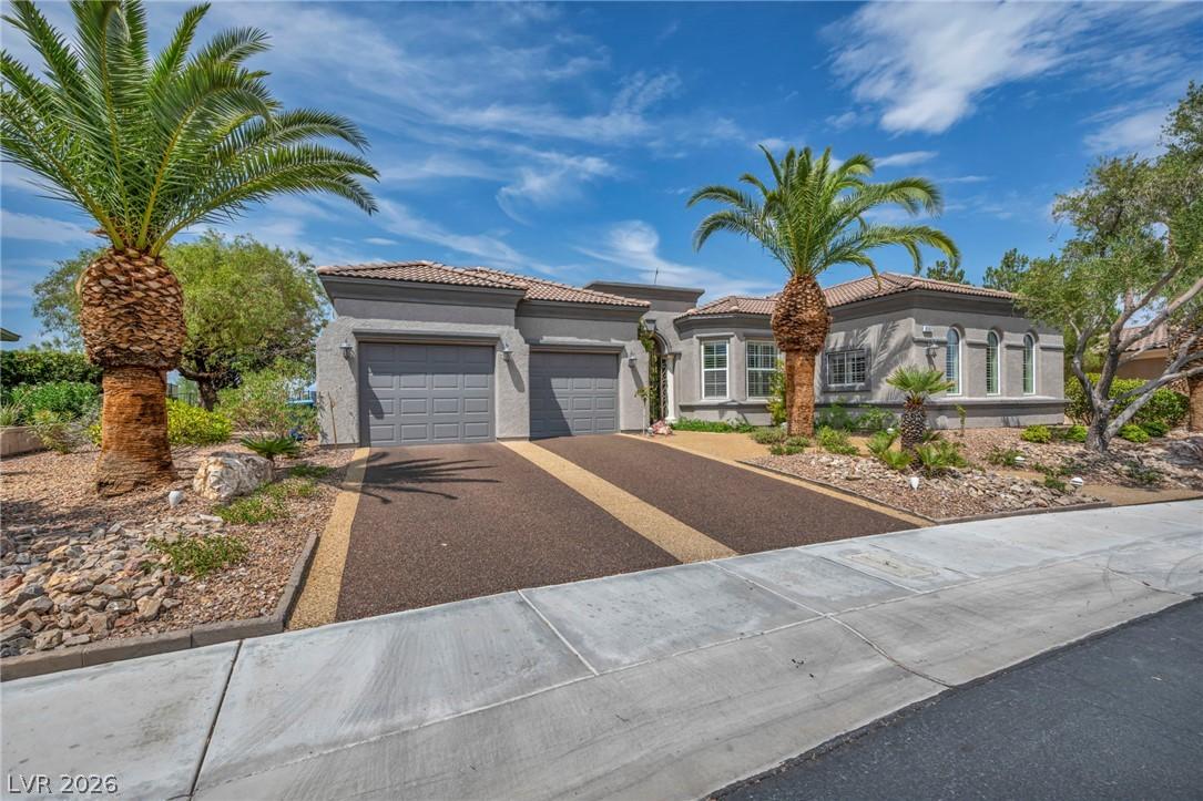 Image 3: Mature palm trees adorn the entry to this graceful
