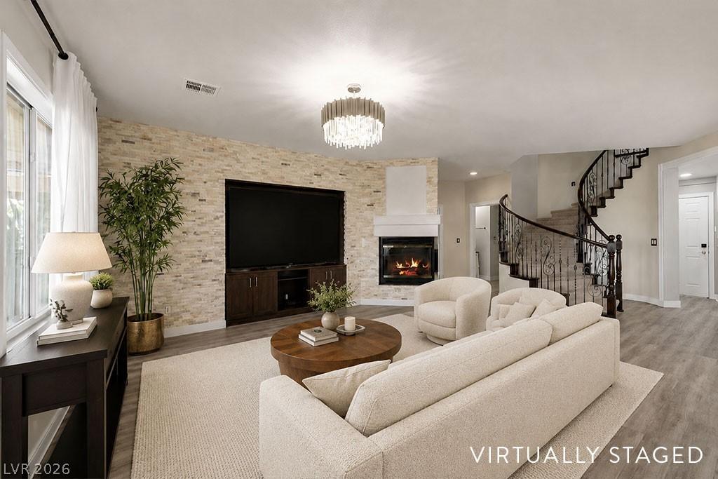 Image 3: This family room showcases a stunning light-stone
