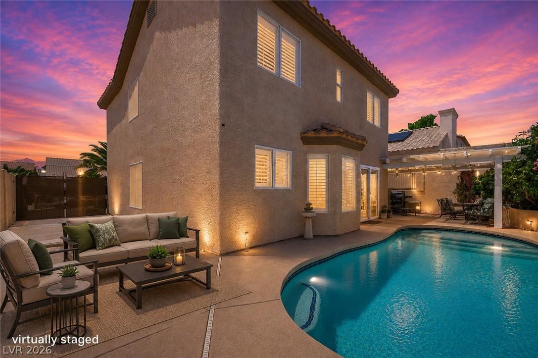 Image 2: An inviting pool and patio area, perfect for unwin