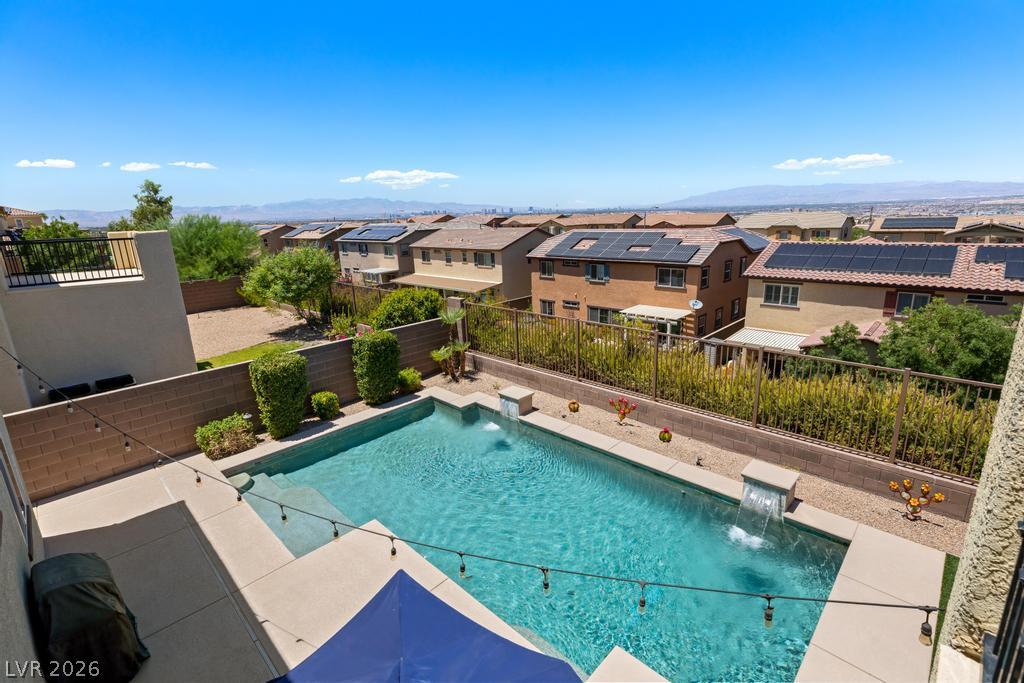Image 4: Discover a private backyard oasis with an inviting
