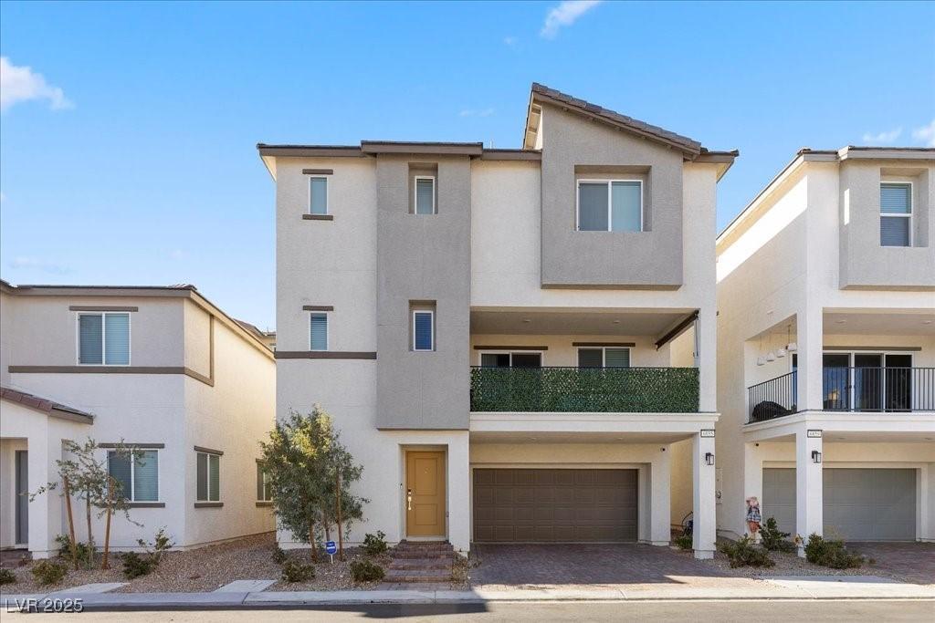 Image 4: View of front of house featuring stucco siding, a