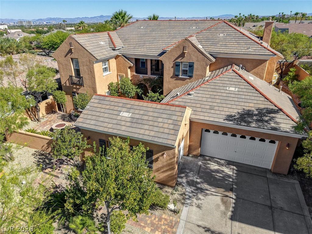 Image 1: An inviting front elevation presents a tiled roof,