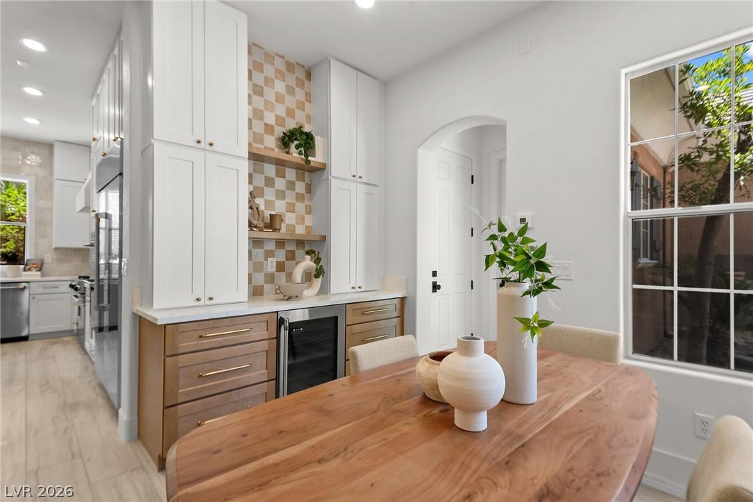 Image 2: A well-appointed kitchen features a beverage coole