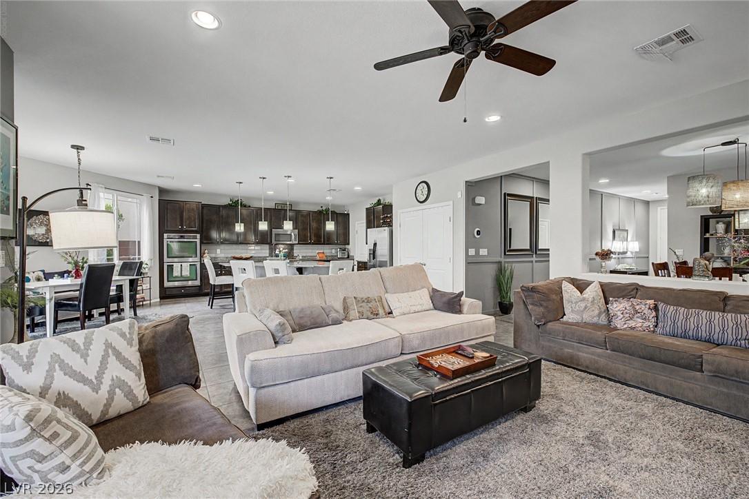 Image 3: An inviting open-concept living area flows seamles