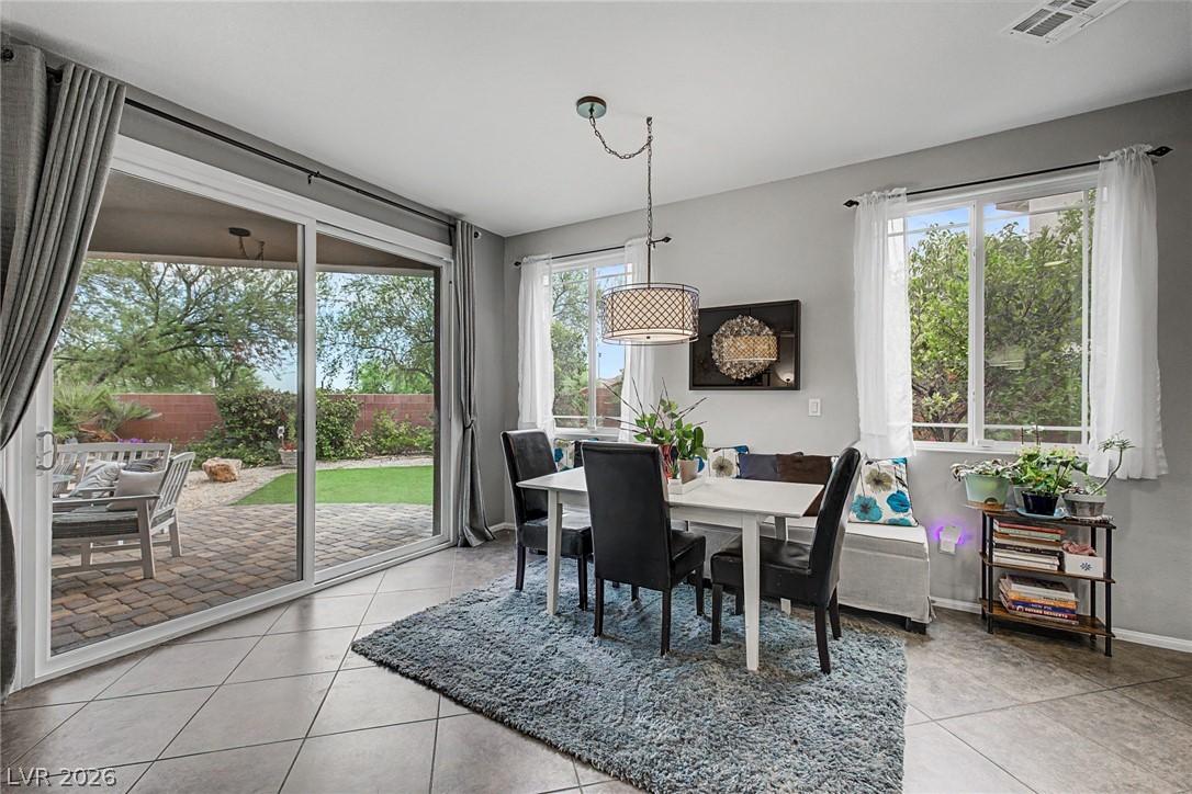 Image 4: A well-lit dining area offers direct access to the