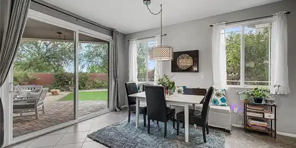 Image 4: A well-lit dining area offers direct access to the