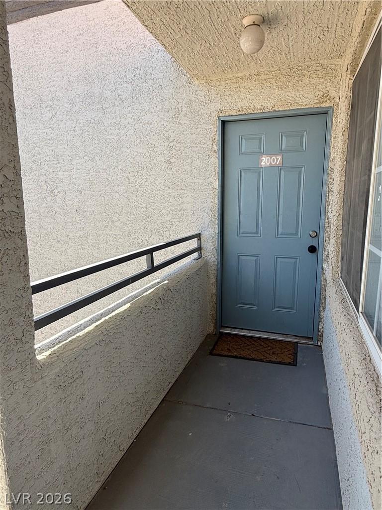 Image 2: Welcome home through a robust blue entry door, off