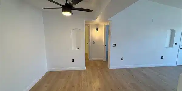 Image 4: Clean lines and light wood flooring define this op