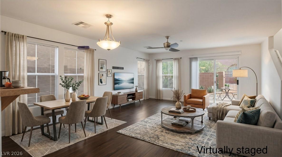 Image 1: Virtually staged living/dining area showing you th