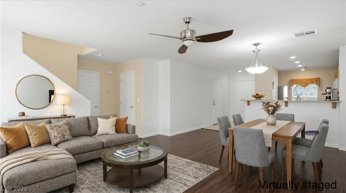 Image 2: Virtually staged living/dining area showing you th