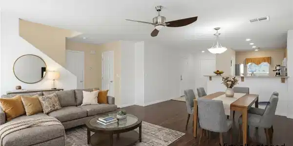 Image 2: Virtually staged living/dining area showing you th