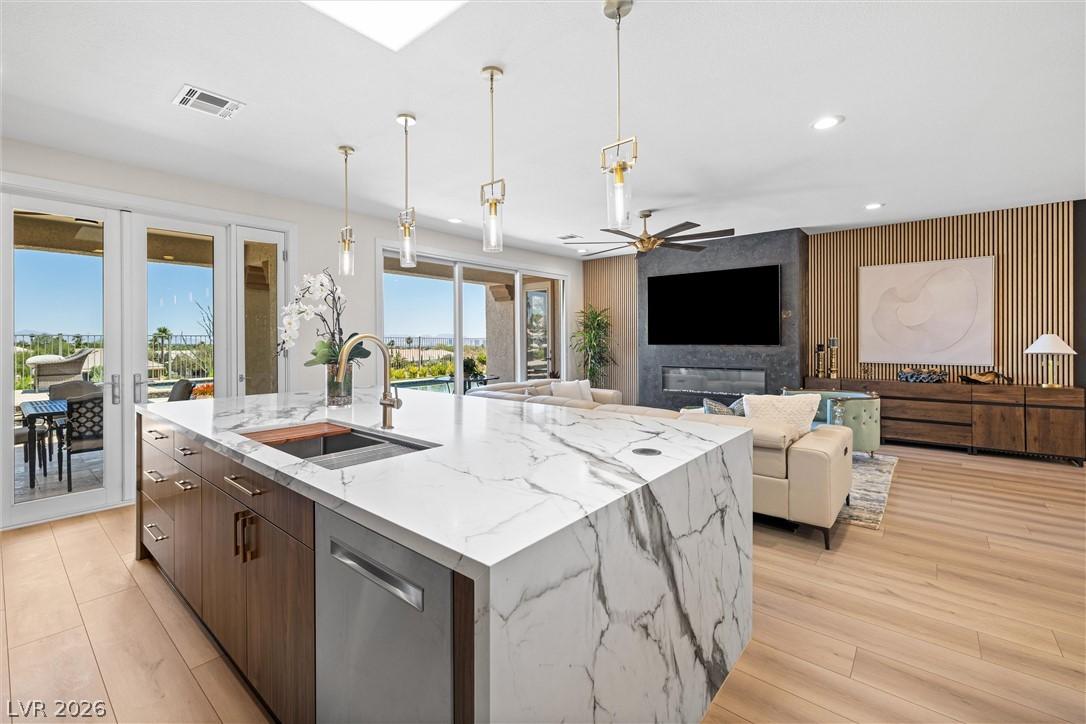 Image 1: A grand marble kitchen island and open floor plan