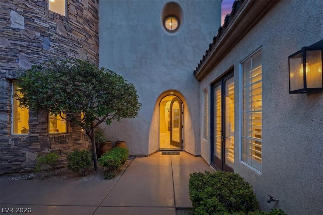 Image 3: Enter through a distinctive arched doorway into a