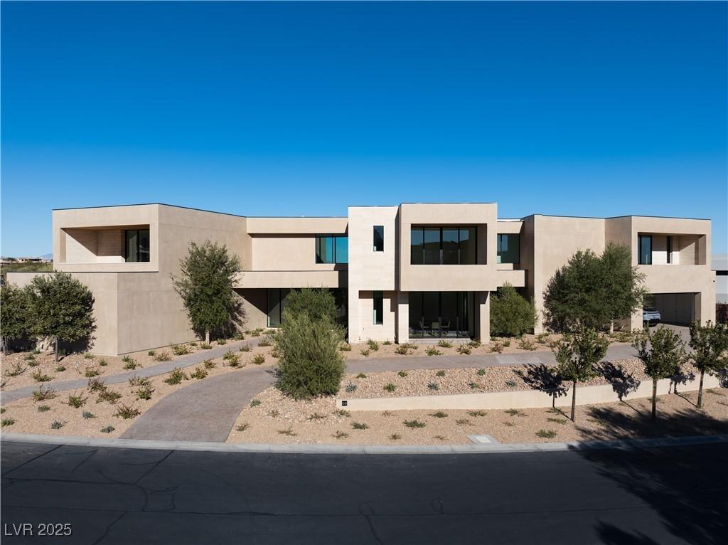 Image 1: Modern home with stucco siding