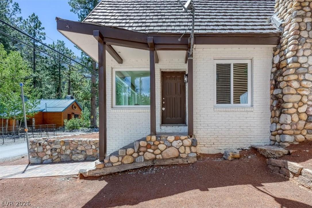 Image 3: This charming home offers a cozy entryway and dura