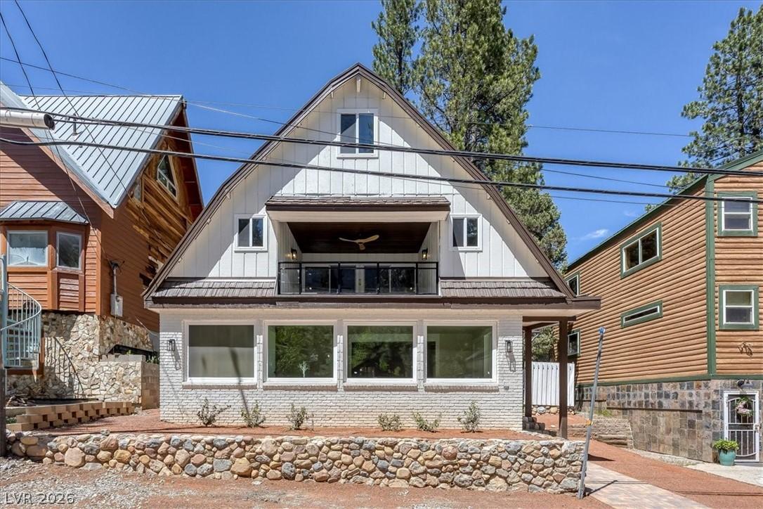 Image 4: This charming alpine home features a unique gabled