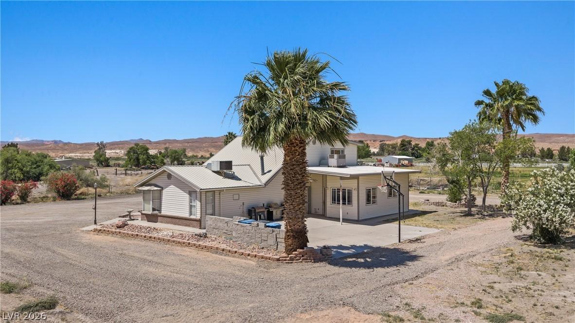 Image 4: This desert oasis features a charming home with ex